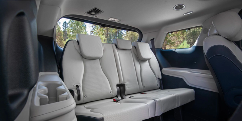 ird-row seating with cupholders inside Kia Carnival