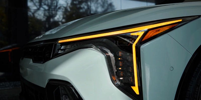 Close-up of the Kia K4 LED headlights with a modern and distinctive lighting design