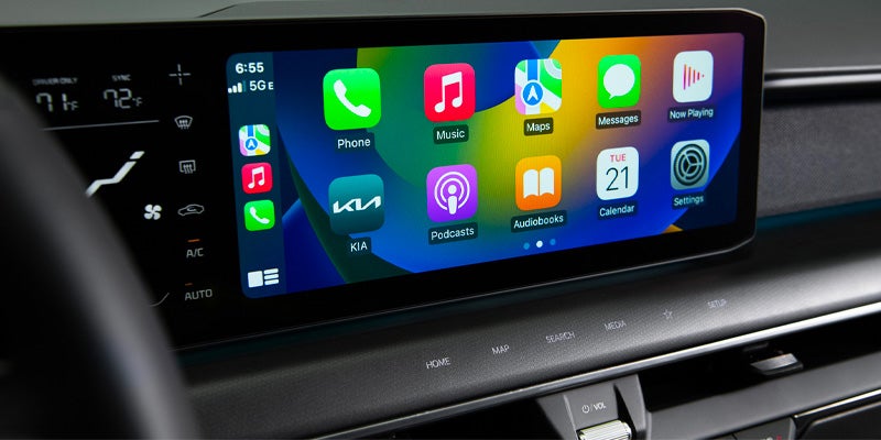 The infotainment screen showing the Apple CarPlay app interface