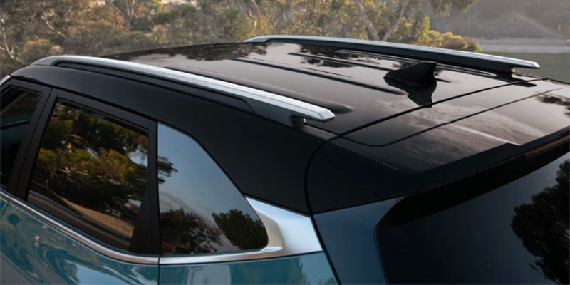 A blue Kia Seltos from a low front angle