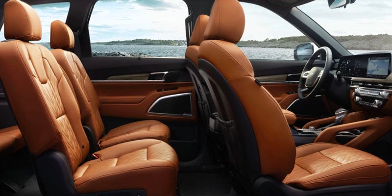 The interior of a Kia Telluride with brown leather seats